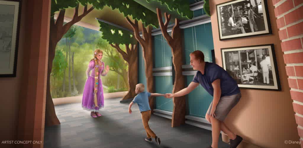 A woman and a man are playing with a child near a painted forest mural on a wall featuring trees and sunlight