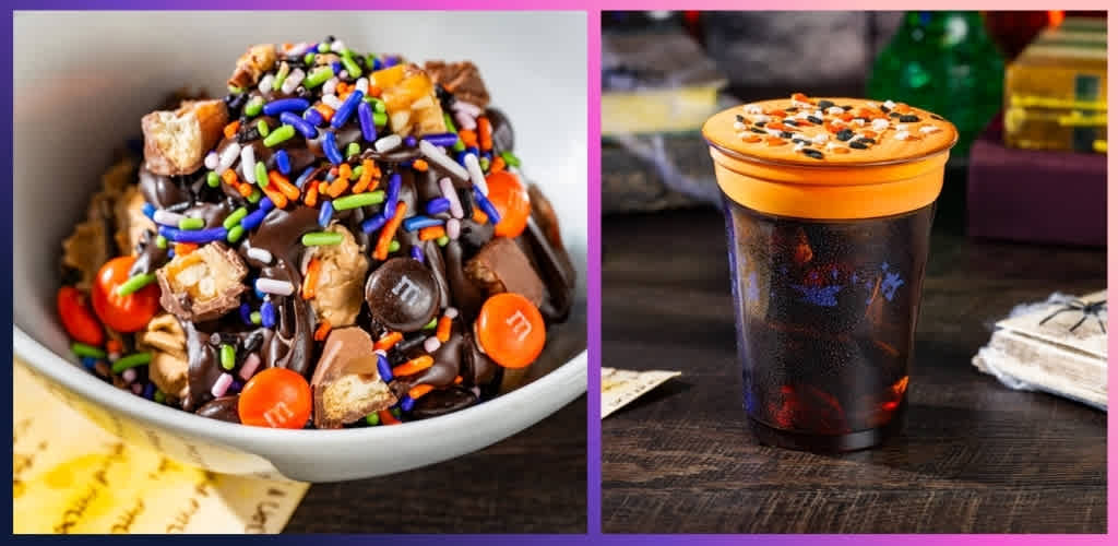 A bowl of ice cream topped with colorful sprinkles, candies, and chocolate, next to a coffee cup with orange lid and sprinkled topping on a wooden table.