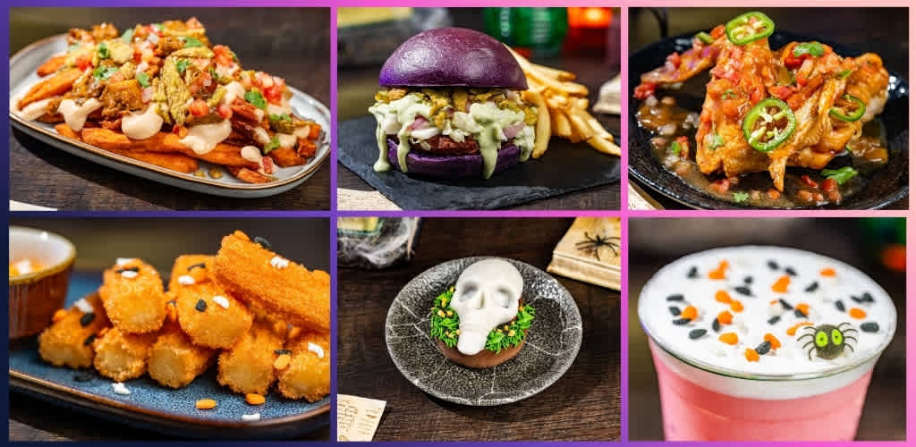 Collection of spooky Halloween-themed foods including nachos, a purple burger, fried chicken, mozzarella sticks, a skull-shaped dish, and a ghostly pink beverage.