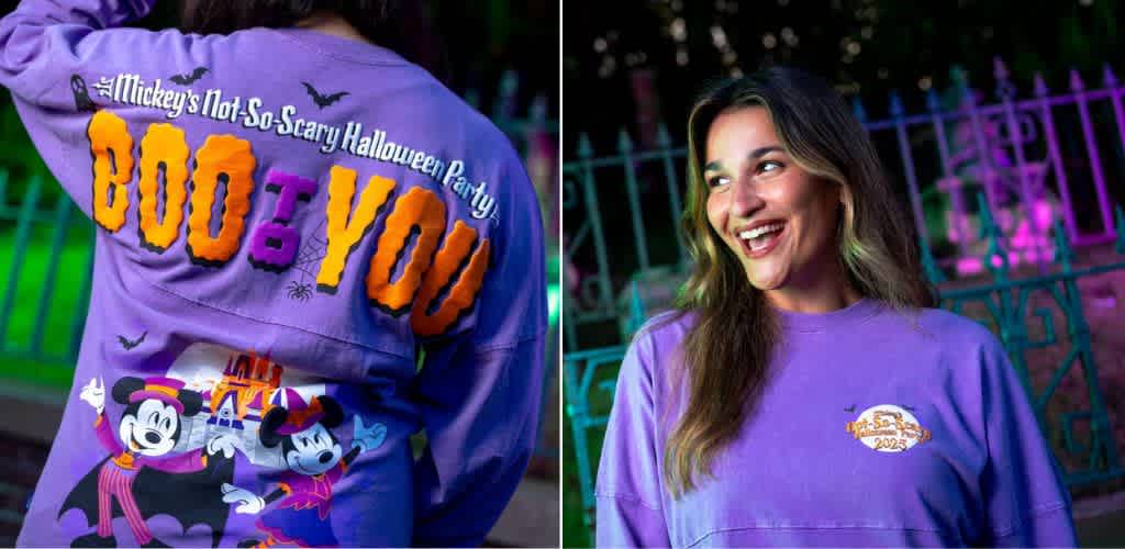 Woman wearing a purple Halloween themed sweatshirt at a night event smiling outdoors