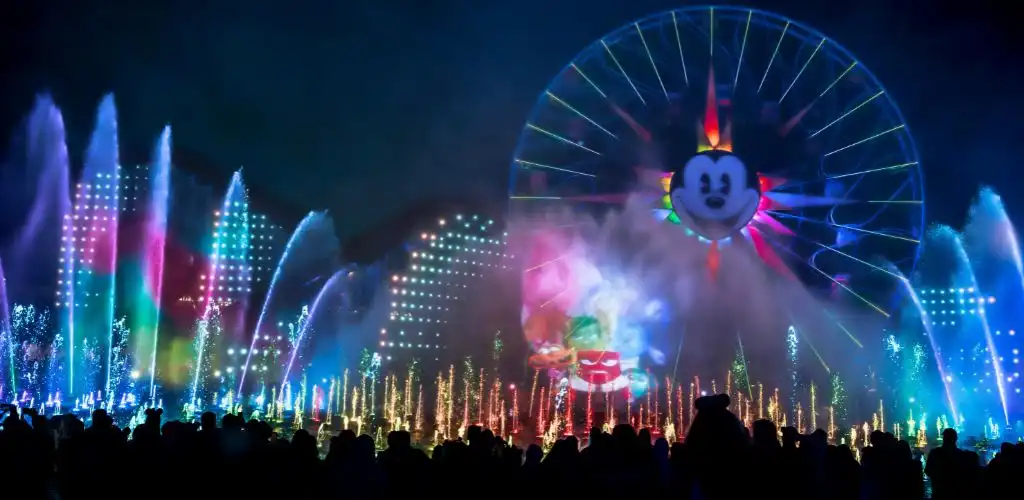 Disneyland's new nighttime spectacular features vibrant lights and fireworks, creating a magical experience for all visitors.