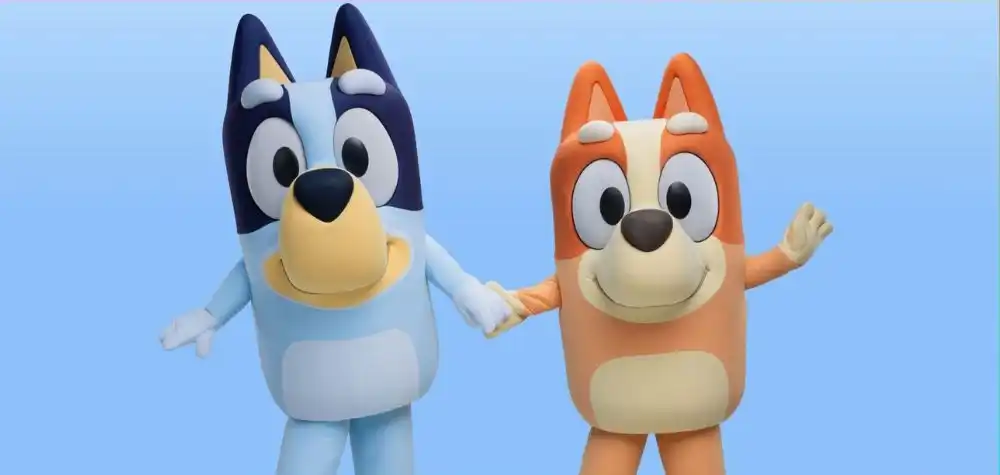 Two animated dog characters holding hands with a blue sky background