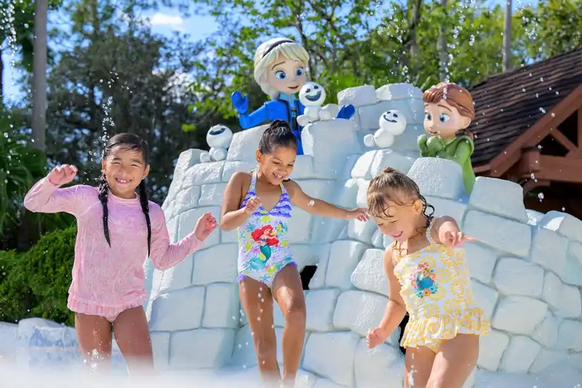 Kids splashing and playing at Disney’s Blizzard Beach Water Park, enjoying a fun, snowy-themed water adventure with whimsical ice castle decorations.