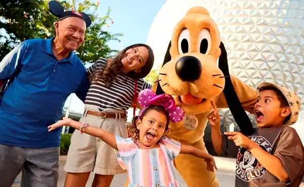 A multigenerational family enjoying a magical meet-and-greet with Pluto at EPCOT, with the iconic Spaceship Earth in the background.